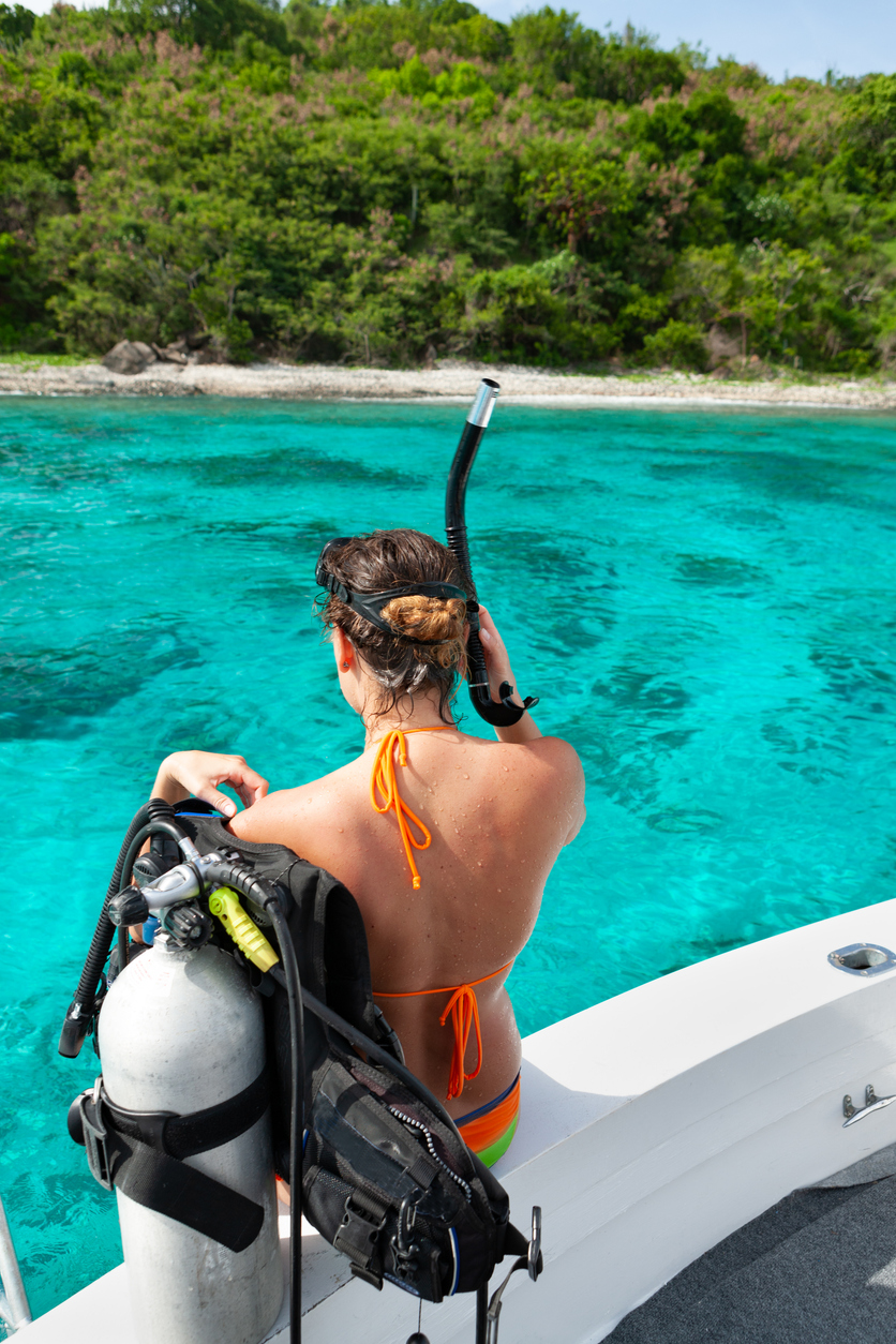 woman diver preparing for a scuba dive in the caribbean